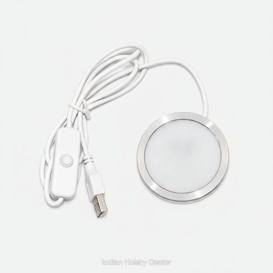 A white USB-controlled LED under-shelf light with a circular silver metal frame, white cable, and inline switch on a white background.
