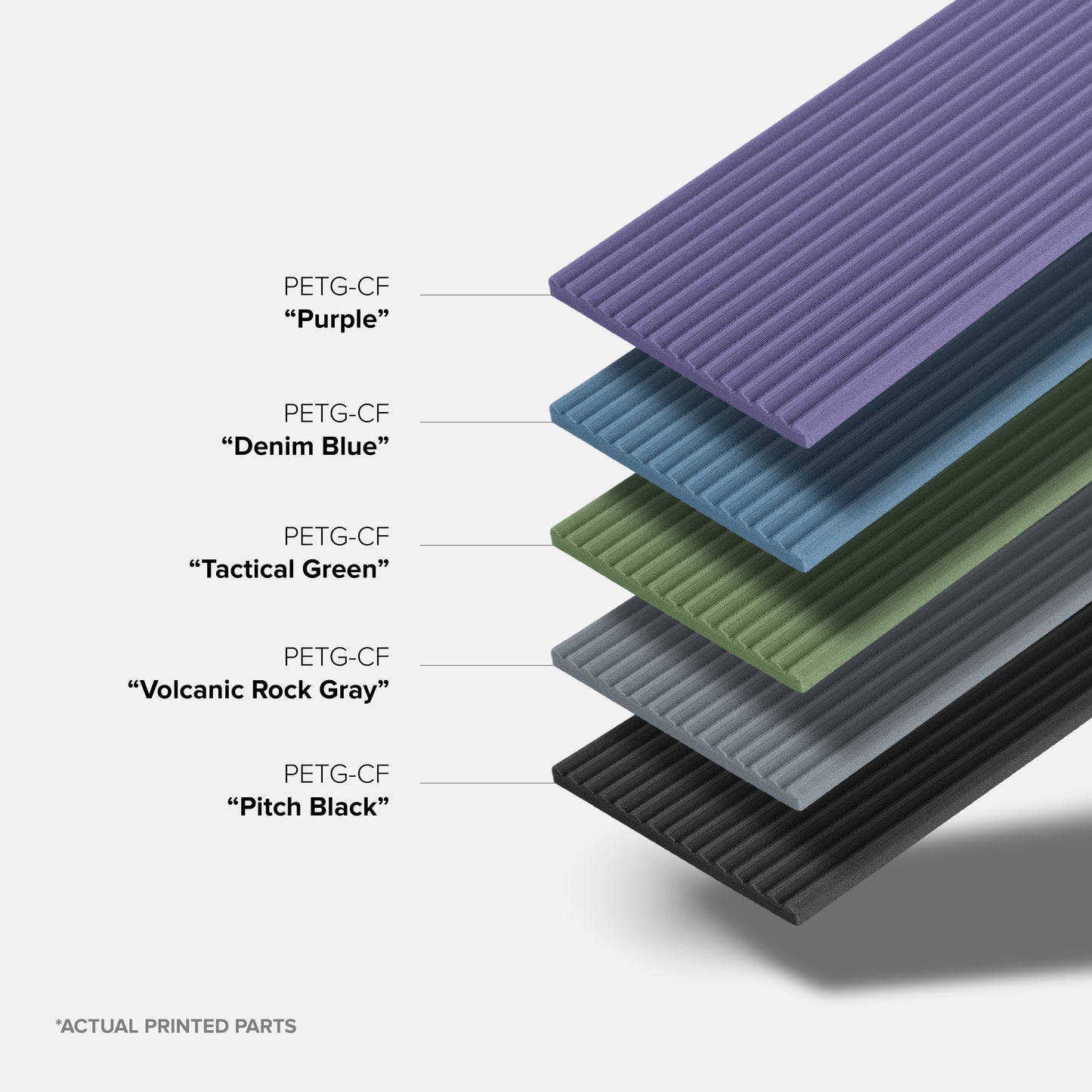 Stack of PETG-CF printed parts in various colors on a white background