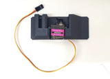 A black servo dispenser air drop rack kit with an attached orange wire and a MG90 servo motor.