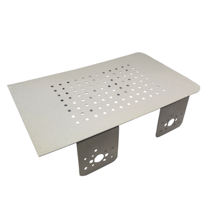 Metal table with perforated top and four legs on a white background