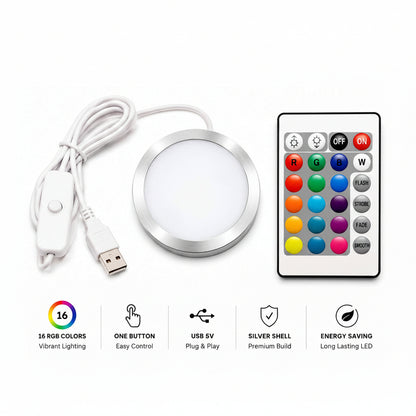 round LED under-cabinet light kit with a white USB cable, a silver-rimmed circular light, and a multi-color remote control, shown on a white background with feature icons below.