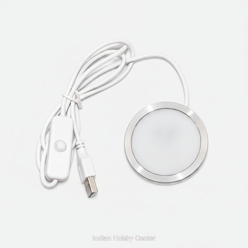 A white USB-controlled LED under-shelf light with a circular silver metal frame, white cable, and inline switch on a white background.