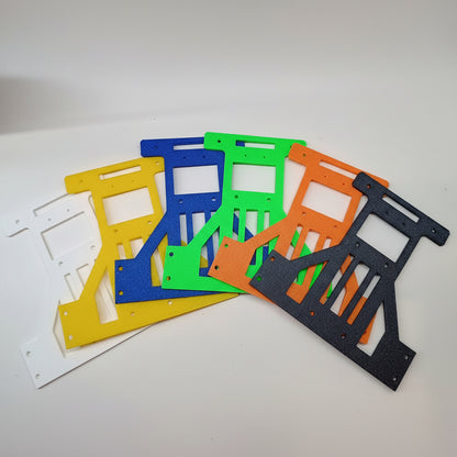 A collection of 3D printed chassis for robotics projects, displayed in multiple colors including blue, green, orange, yellow, and black.