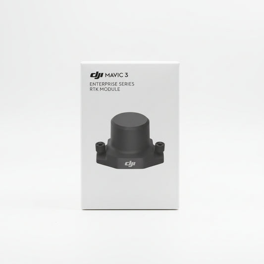 DJI Mavic 3 Enterprise Series RTK Module packaging held by a hand on a wooden surface