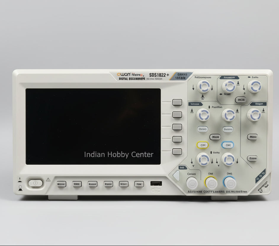 Digital oscilloscope on a table with technical literature in the background