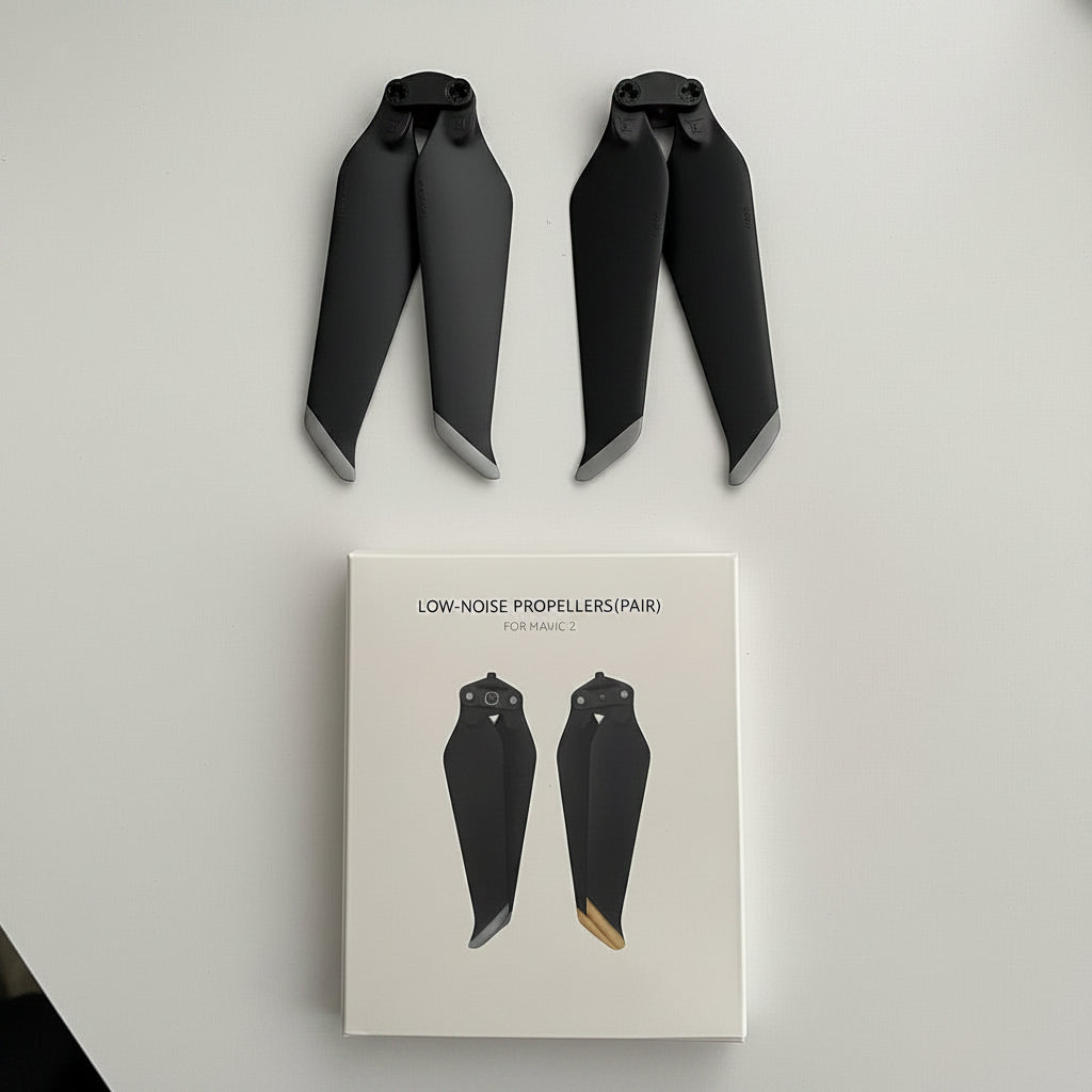 Two black propellers with gray tips displayed above their white retail box labeled 'LOW-NOISE PROPELLERS(PAIR) FISHAWL C'.