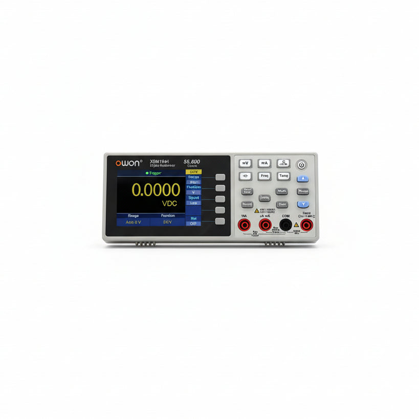 An OWON XDM1041 Digital Multimeter with a True RMS- Mini Benchtop USB Interface. The multimeter has a silver body and a digital display screen showing various measurement options like voltage and resistance.