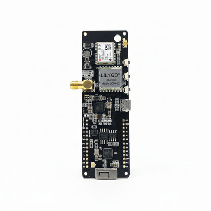 An electronic module with various connectors and antennas, labeled with 'LILYGO' and 'TTGO' branding, intended for IoT and wireless applications.