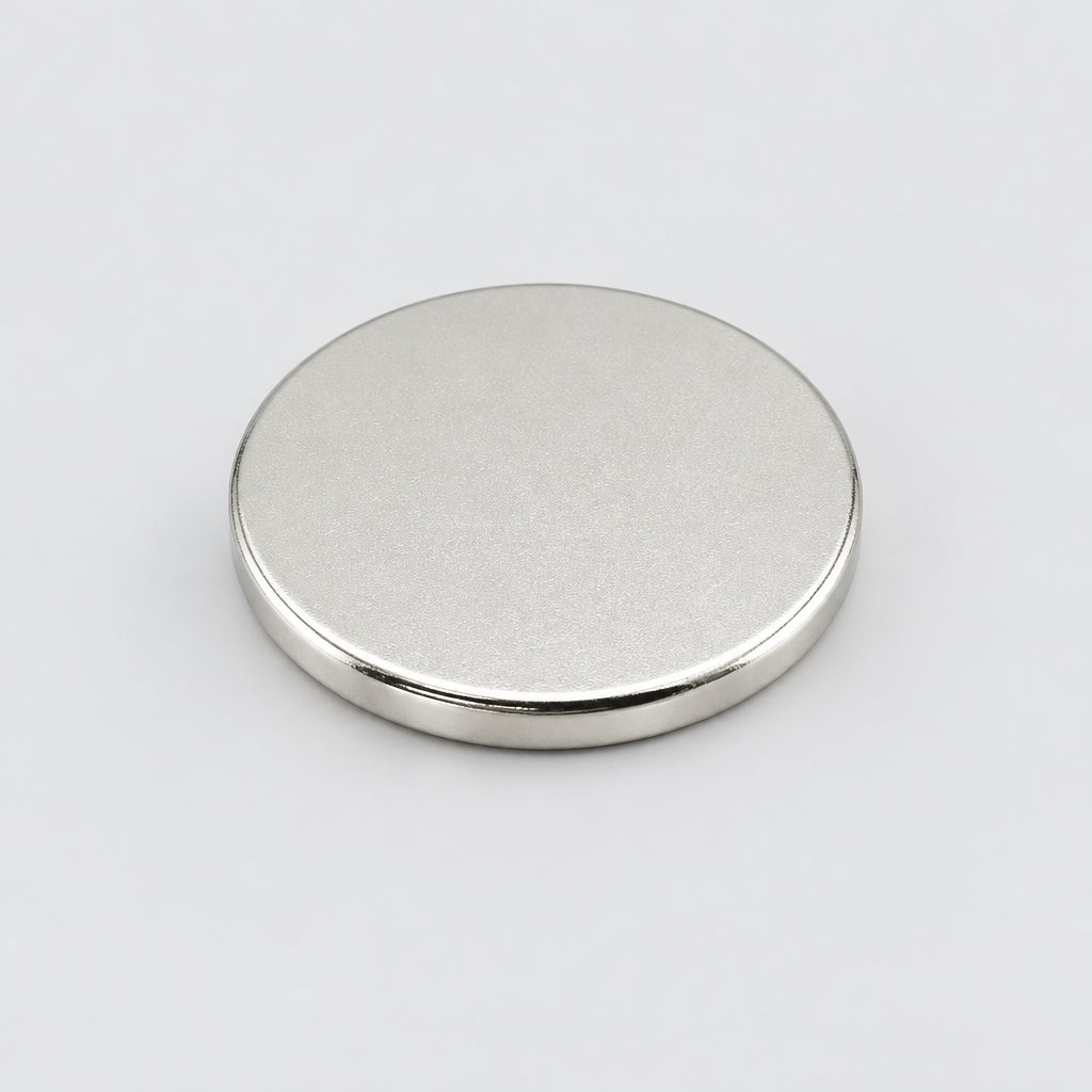 A circular neodymium magnet with a nickel plating, disc-shaped, 